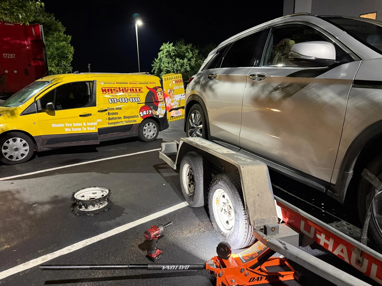 Crossover vehicle lifted for roadside tire service