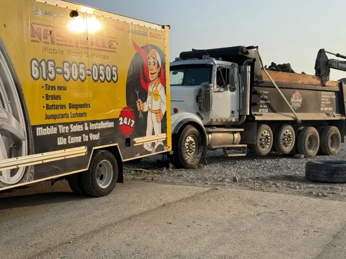 Nashville Mobile Road Service truck beside a commercial vehicle